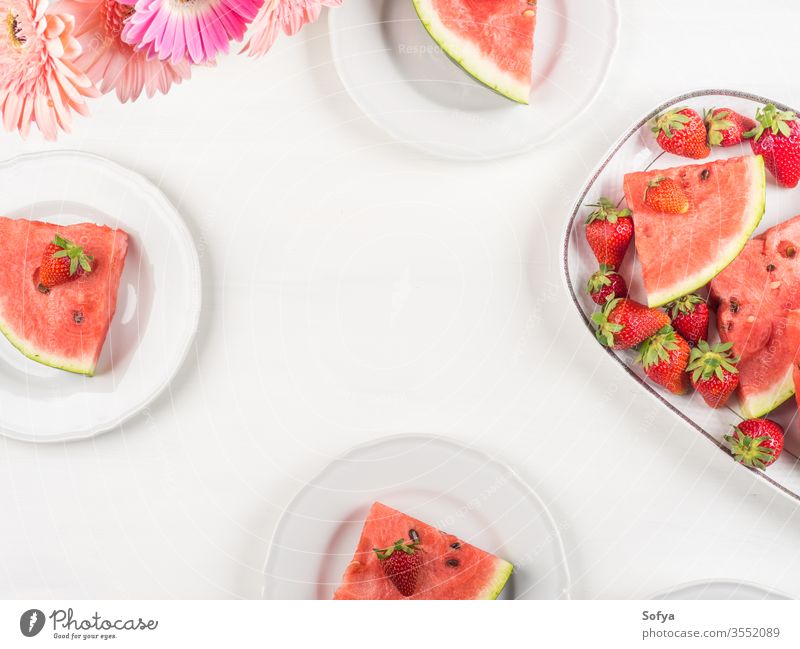 Watermelon slices on tray on white wooden table watermelon summer strawberries ceramic pink fresh snack flowers delicious beautiful bright eat food sweet party