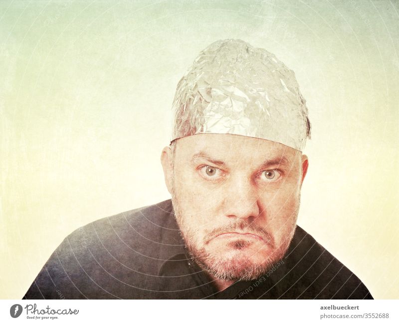 Angry citizen with aluminium hat Aluminium hat carrier angry bourgeois Conspiracy theory rabid Skeptical Bad mood aluminium foil Hat Protection mind control
