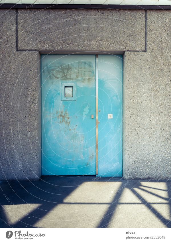 Door Shadow Turquoise Blue Metal Wall (building) Window Closed White Entrance House (Residential Structure) Deserted Colour photo Exterior shot Wall (barrier)