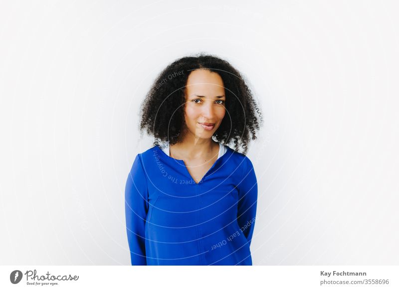 portrait of cheerful black woman in blue dress 25-30 adult african-american attractive beautiful beauty confidence curly day emotion ethnic ethnicity female