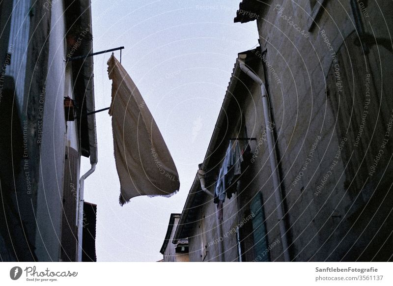 Washing in the wind Wind Summer Twilight Southern France Laundry Deserted Exterior shot Washing day Dry hang Street Colour photo Backyard freshness