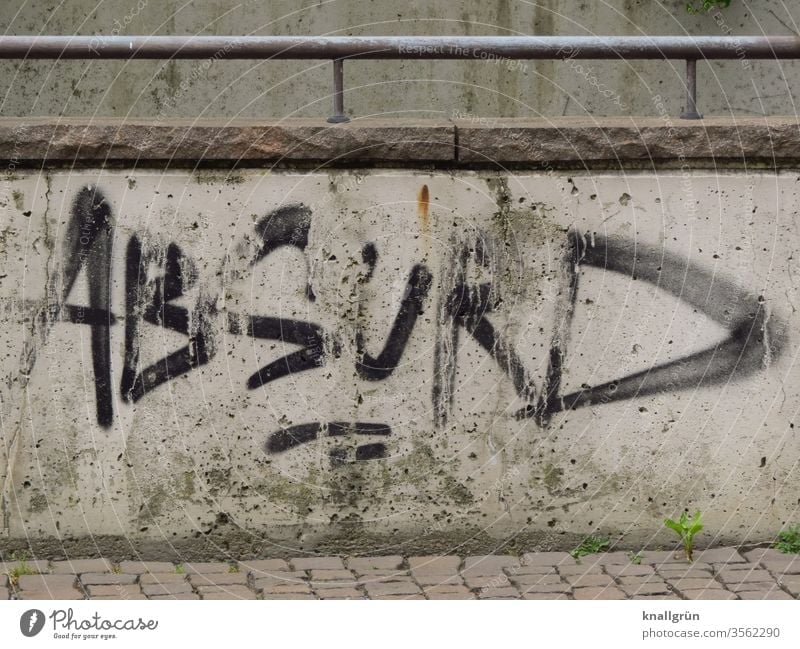 Black graffiti "ABSURD" on white, dirty wall Graffiti Communicate Absurd Characters Letters (alphabet) Word leap Language Latin alphabet letter communication
