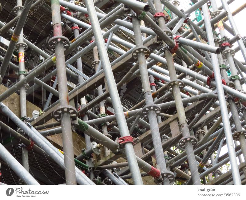 scaffolding Scaffold Metal Construction site Silver Crossbeam Connection muddled metal pipe Pattern tight Scaffolding Workplace Colour photo Deserted