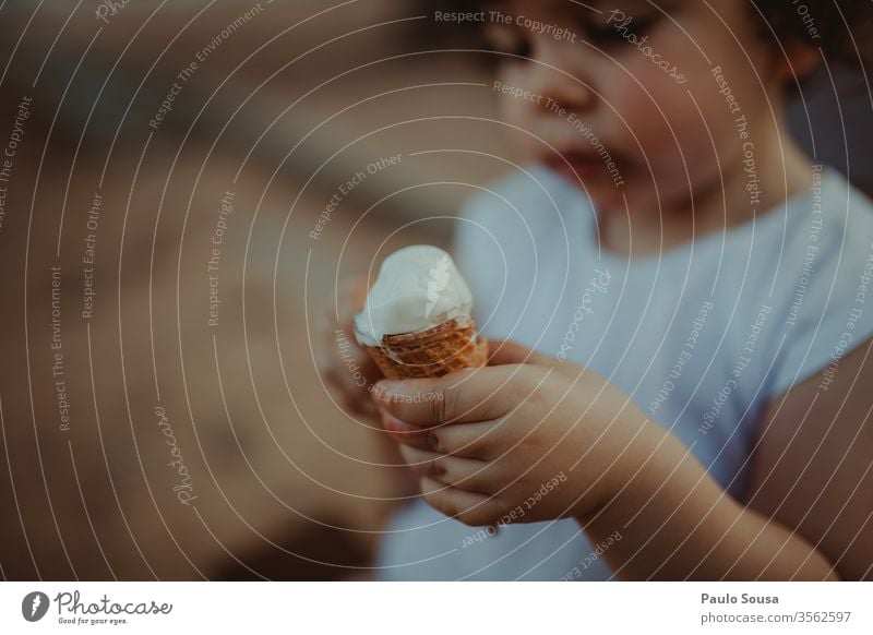 Child holding ice cream Ice cream Ice-cream cone Summer Nutrition Candy To enjoy Ice cream ball Dessert Waffle Food Delicious Colour photo Eating