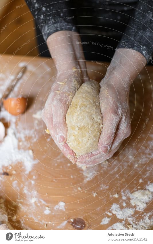 Crop female cook kneading dough on table flour egg pasta prepare rolling pin eggshell pastry kitchen ingredient elastic process woman food cuisine tool culinary