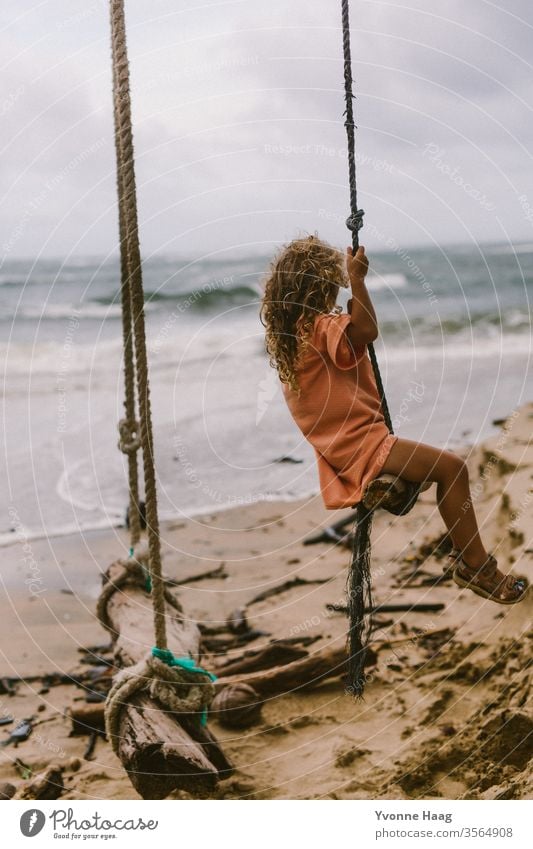 Swinging towards the sea Hawaii Hibiscus To swing Rocking Joy Playing Exterior shot Colour photo Playground Infancy Day Child Children's game Copy Space right