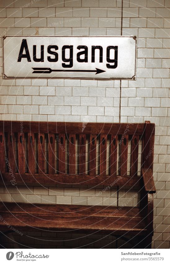 Ausgang in U-Bahn Berlin Subway station exit Exit route Bench Way out Arrow Direction Wall (building) Characters Colour photo Signs and labeling Signage Germany