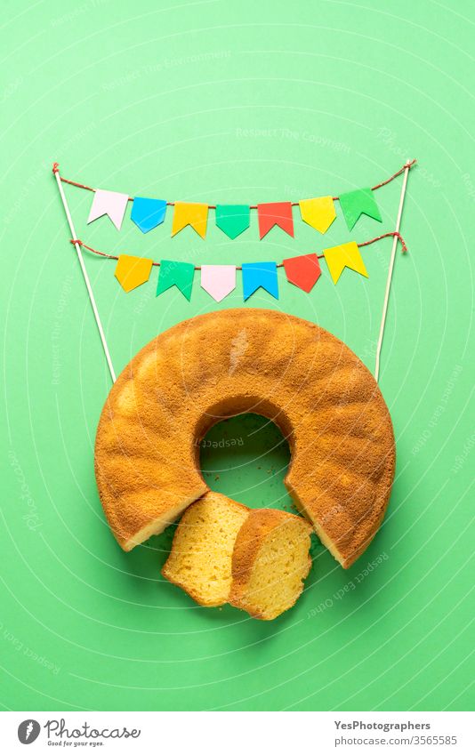 Brazilian cornmeal cake and party flags. Festa Junina festival Bolo de Fuba Portuguese baked bakery brazil festivity brazilian bunting carnival celebration