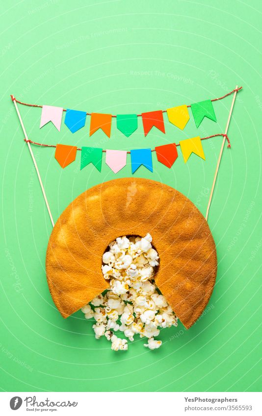 Cornmeal cake with popcorn and party flags. Festa Junina celebration Bolo de Fuba Portuguese baked bakery brazil festivity brazilian bunting carnival colorful