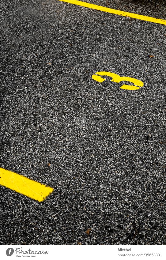 Bold Parking Spot with the Number Three bold yellow background parking spot parking lot number number three lines contrast Digits and numbers