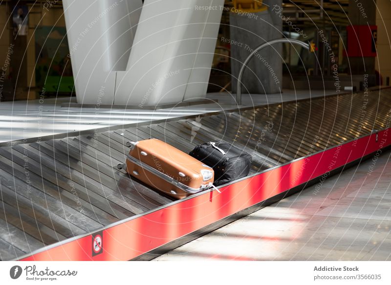 Baggage claim with emergency stop button at the airport baggage claim terminal conveyor belt modern interior futuristic style safety alarm control system