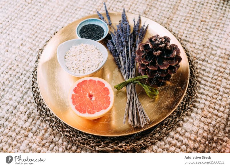 Organic fragrant products on gold tray super food antioxidant grapefruit lavender spruce cone chia sesame natural organic vitamin healthy fresh bowl ceramic
