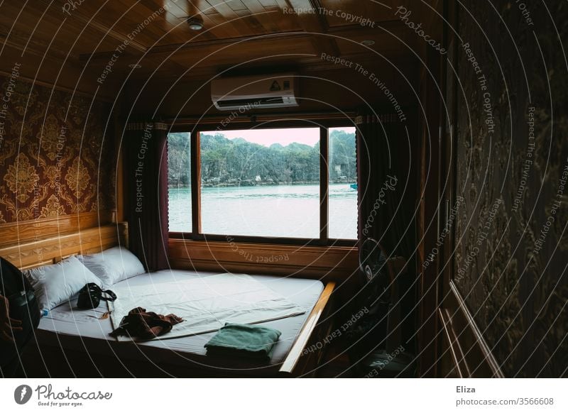 Sleeping cabin of a ship with view of the sea and Halong Bay in Vietnam caesium Halong bay Bed Exceptional especially Vantage point Ocean boat tour
