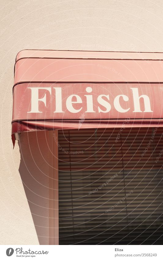 The word meat on a pink awning in front of a butcher's Meat meat consumption Butcher Butchery Eating Food Nutrition Sausage Exterior shot Day Closed deal Word