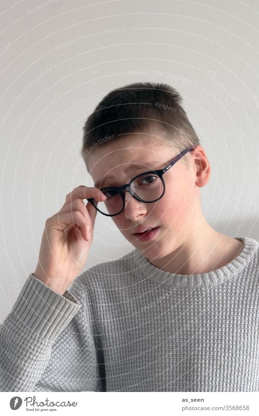 Boy with glasses Boy (child) Eyeglasses by hand think ponder concentrate Think Looking portrait Face Eyes Hair and hairstyles Thought Emotions Head Concentrate