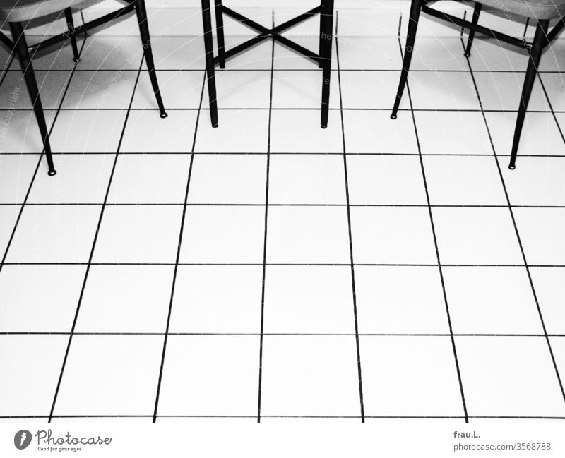 chic tiles - nice legs - nice chairs - chic table Table cake floor Deserted Chair Tile Living or residing Flat (apartment) Interior shot Shadow