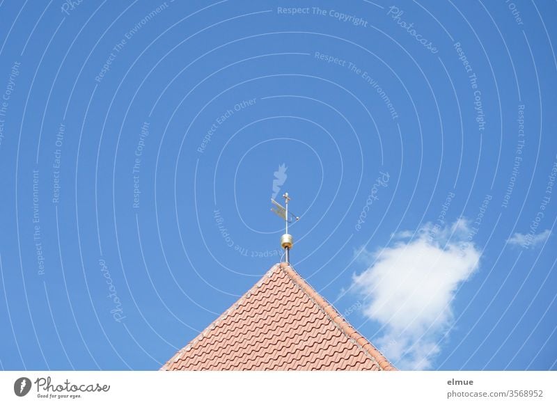 Top of a church roof with tower ball and wind vane in front of a blue sky and a small cloud Tiled roof Vane decorative cloud Tower ball Pointed roof Triangle