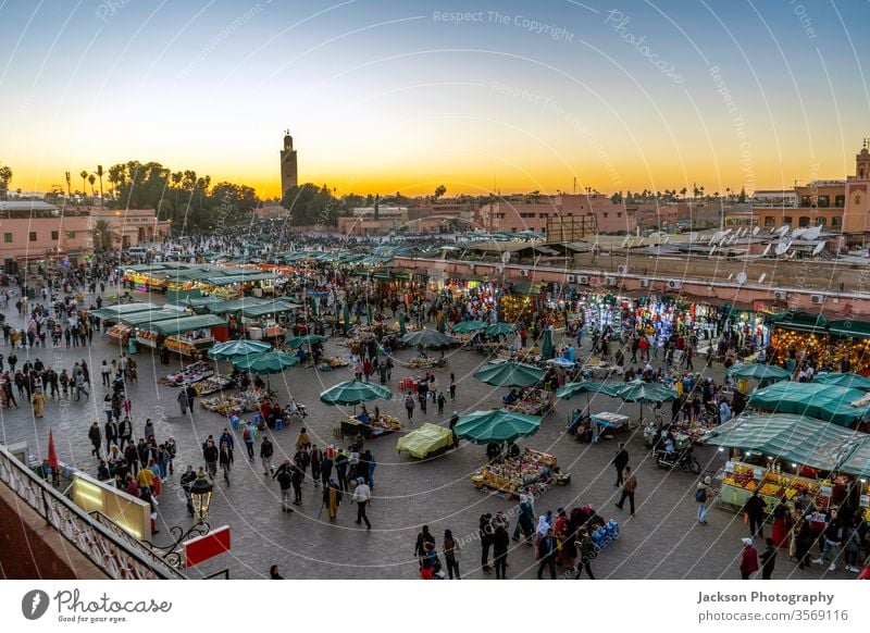 Main market square called Jama El Fna in Marrakech, Maroko morocco marrakech people mosque jamaa attraction old minaret food crowded architectural oriental