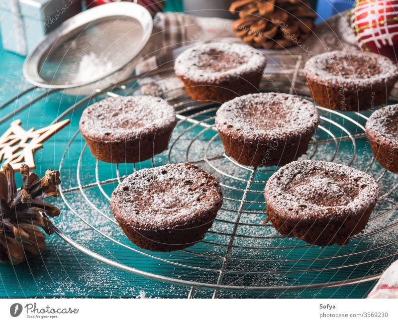 Chocolate winter muffins with icing sugar christmas chocolate cocoa chokecherry cake food treat bake cook recipe breakfast holiday decoration snow flake pine