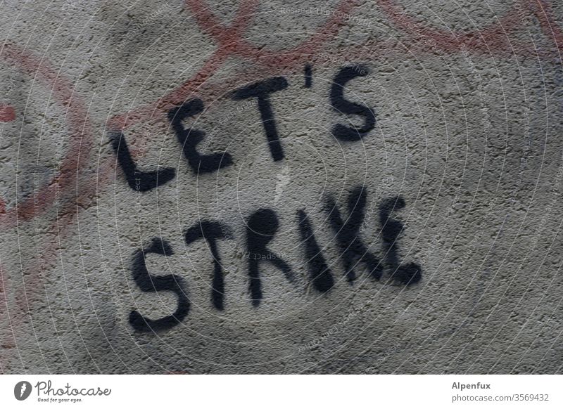 LET'S STRIKE | taken literally Graffiti House (Residential Structure) Architecture Facade Wall (building) Characters Town Colour photo built Wall (barrier)