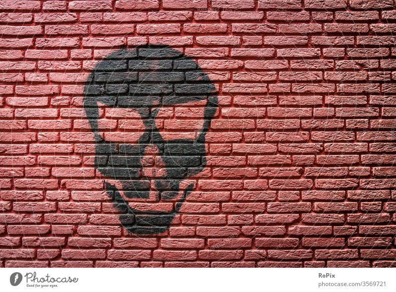 Grimace on a red brick wall. Wall (building) rampart by hand Fingers Brick Architecture House (Residential Structure) house wall Town urban Art fingerprints