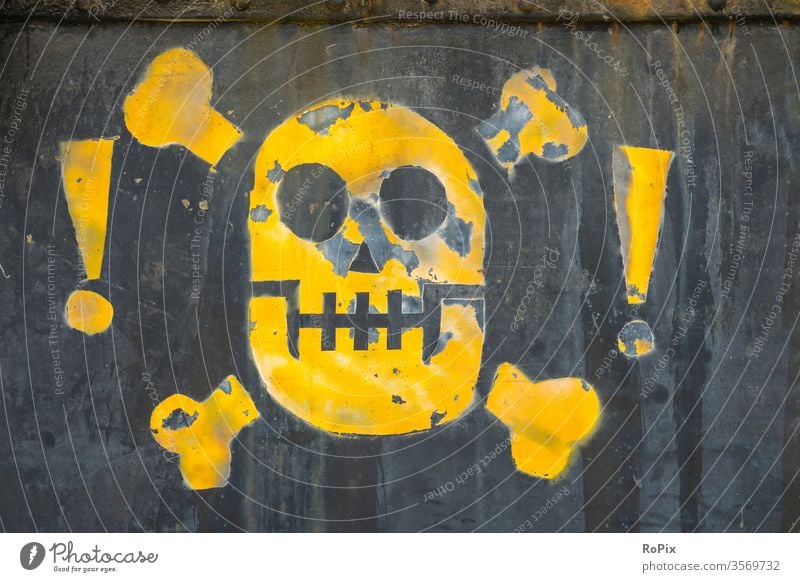 Abstract skull on an industrial plant. smoke fire exit safety Emergency exit message sign Warn Smoking Wall (barrier) bricks unauthorized Red premises Steel
