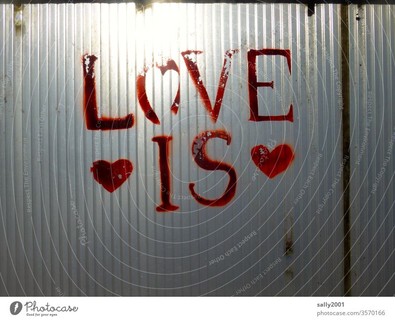 is love! Love Heart symbol writing Red Graffiti sensation emotional expression Declaration of love Plastic wall plastic Translucent Sun Old peeled off lettering