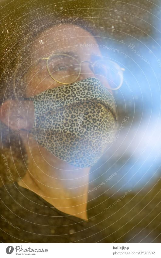 Woman with breathing mask at the window Respirator mask Mask Human being Threat Fear 1 portrait Protection Adults Virus pandemic coronavirus flu Healthy Illness