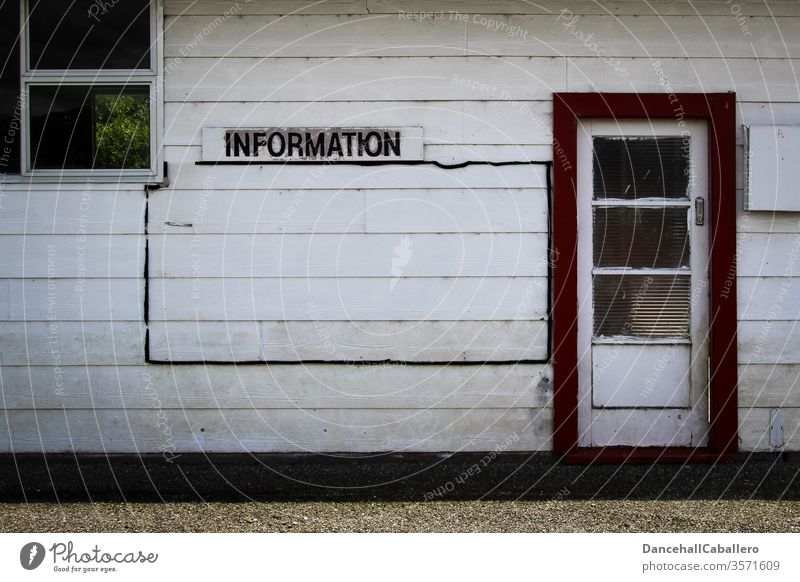 Wooden wall with sign Information Advice Communication Signs and labeling Signage Characters Wall (building) door Window Clue Communicate experienced Know
