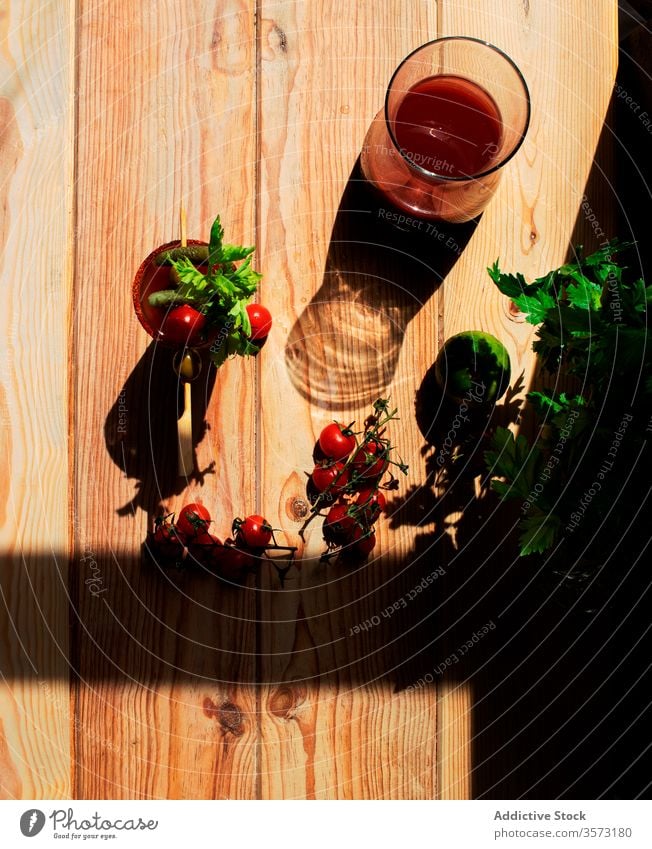 Virgin blood mary on a wooden table nutrition tomato juice health wellness cherry tomatoes organic food ingredient bloody mary color seasoning virgin raw liquid