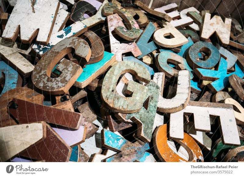 Coloured letters made of wood Letters (alphabet) wooden letters variegated letter g Colour photo Creativity Detail Muddled wordless havoc