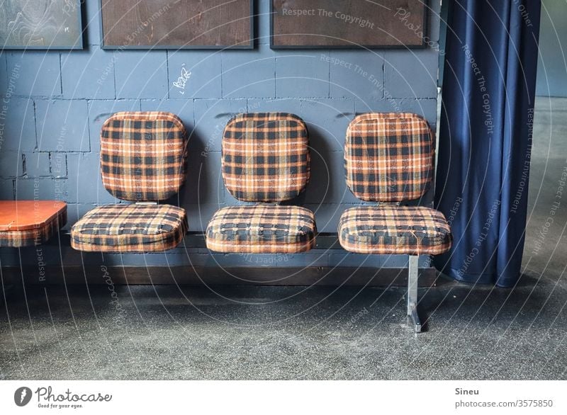 Checked seating row "Flotter Dreier" bench Row of seats chairs Checkered checkered reference Seating Chair Furniture seating furniture Sit Wait Gloomy Places