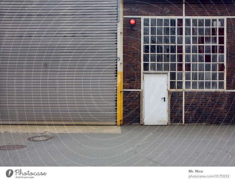 Hall with rolling gate ,door and window Goal Rolling door Window Closed Gray Entrance Building Architecture Storage Warehouse Stock of merchandise