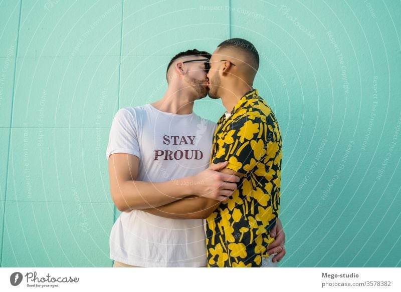 Gay couple hugging and kissing in the street. gay love relationship resting date lovely partnership positive city freedom life young pride dating looking