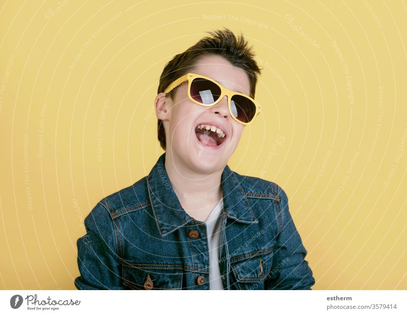 happy and smiling boy with sunglasses kid childhood protection cool summer lifestyle fashion modern happiness positive portrait smile people expression fun