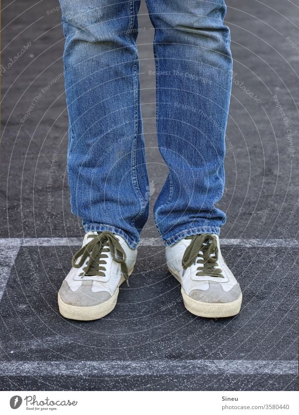Jeans and sneakers Legs Male Legs feet foot Footwear jeans dress code casually smart casual Stand Street Asphalt Human being Exterior shot Multicoloured