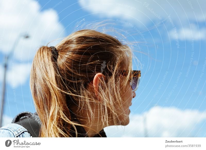 Woman with ponytail and sunglasses looks back already Ponytail brunette Sunglasses Sky Clouds Human being Feminine Long-haired Adults Back of the head turn Ear