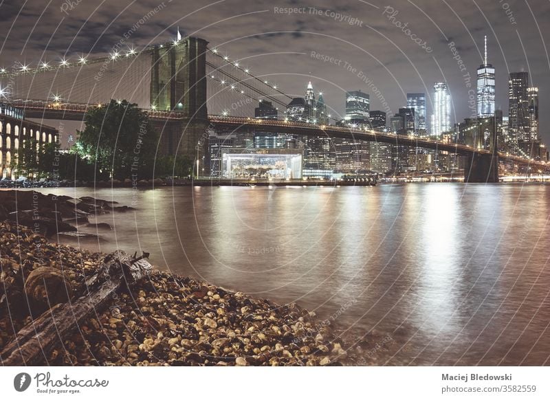 Brooklyn Bridge and Manhattan at night, New York. new york brooklyn bridge city manhattan skyline water reflection usa urban famous nyc panorama filtered toned