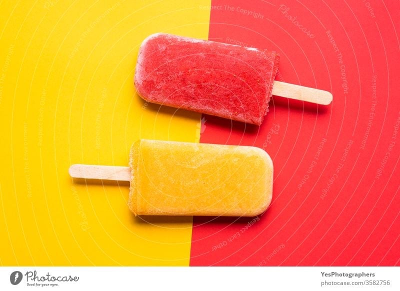 Ice cream popsicles top view. Mango and strawberry icecream above view colorful delicious dessert detox diet exotic flat lay flavor frost frozen fruits ice