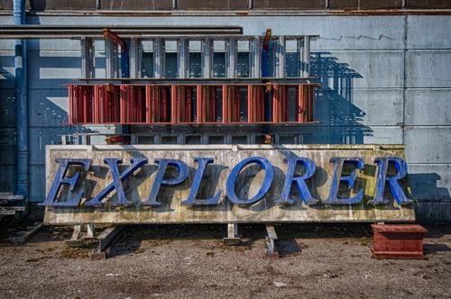 An old neon sign explorer Neon sign Letters (alphabet) Word Light aged graphic graphic design Wall (building) Metal Architecture Sign Art Character