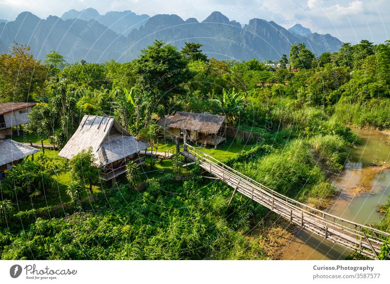 Village and mountain in Vang Vieng, Laos vientiane scenery people thailand luang rice house home lao grass vangvieng riverside rainforest beauty hut jungle