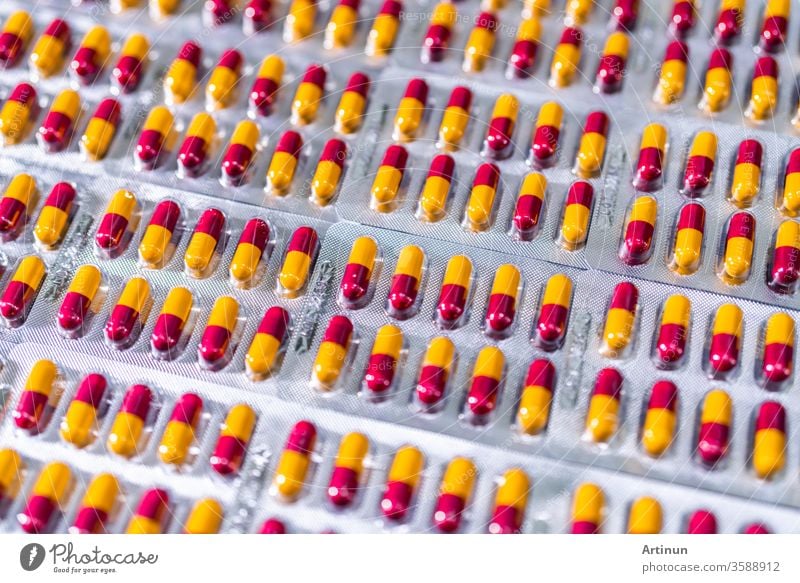 Antibiotic capsule pills in blister pack at production line of pharmaceutical manufacturing factory. Pharmaceutical industry and pharmaceutics concept. Antibiotic drug resistance. Pills packaging.