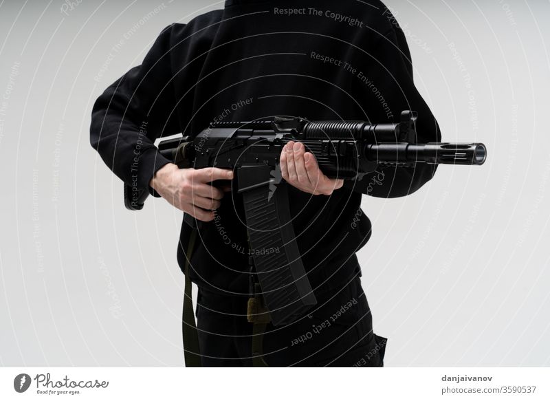 police special forces officer in black uniform isolated on white armed armor background bandit body counter enforcement equipment firearms gun law male mask