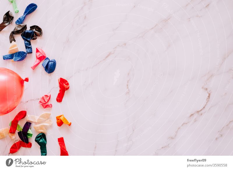 Flat lay of deflated water ballons against a marble background water balloons summer leisure games flat lay flatlay copy space copyspace still still life