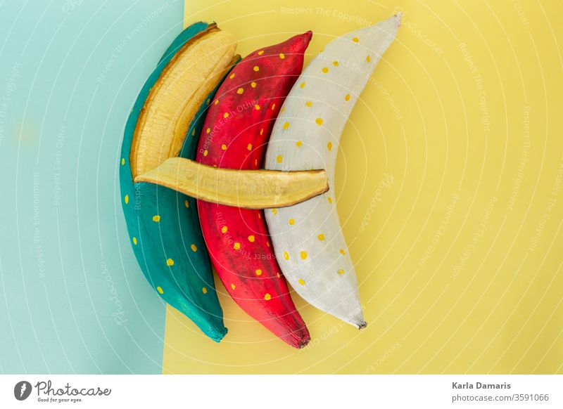 blue banana peel with banana pieces on a blue flat background art artistic attractive beautiful cardboard colors composition concept couple creativity decorate