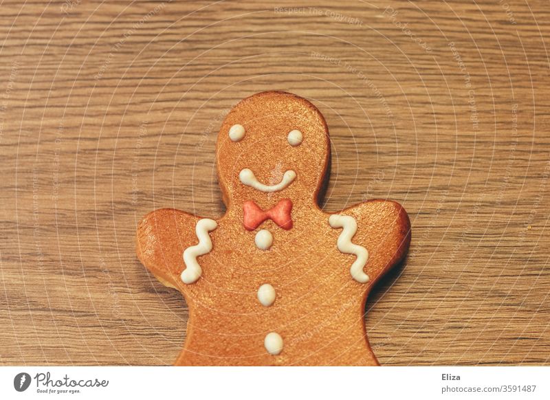Gingerbread man on wood. Christmas. baked Christmas baking little man Christmas biscuit