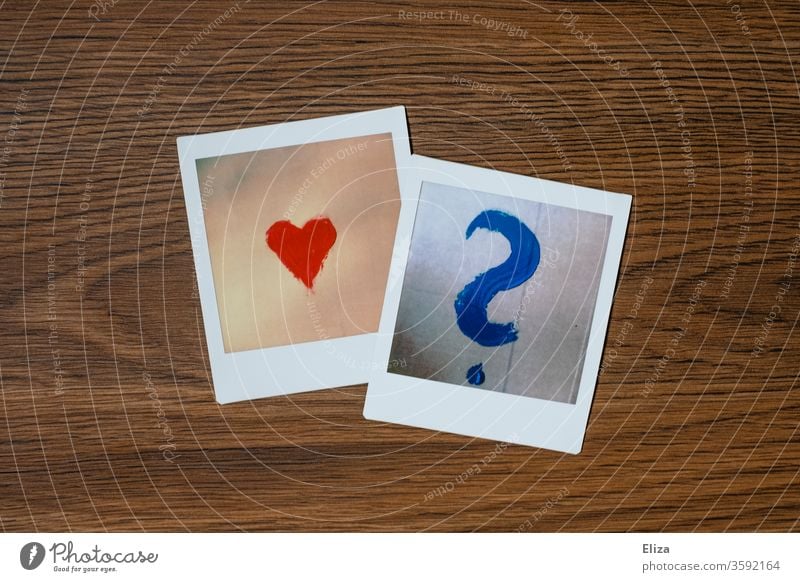 Two Polaroids with a heart and a question mark. Questions of love. Heart Love Question mark uncertainty Love life Emotions Ask Marriage proposal Puzzle