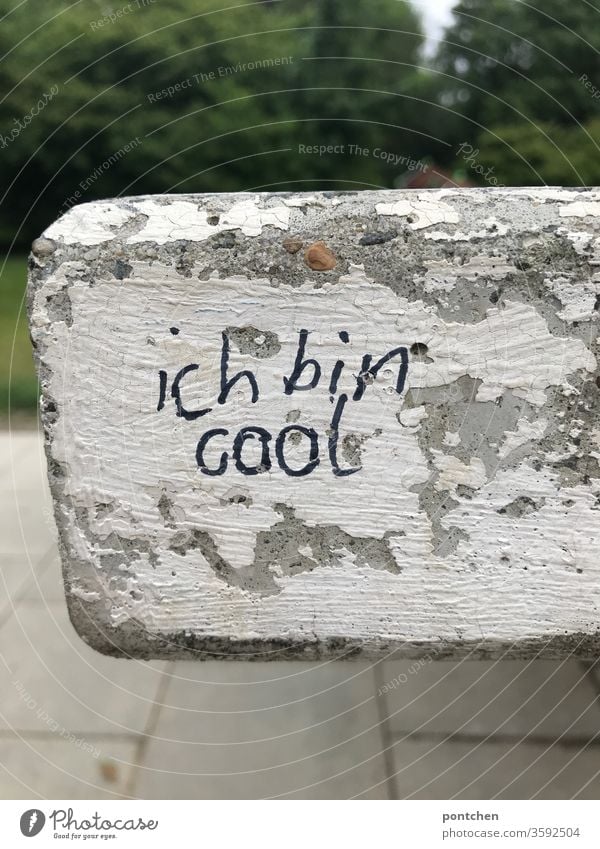 I'm cool. Confident statement full of self-love is written on a stone slab with a magic marker. Phrase, words. Youth Culture Self-Love Daub leap Write Cool