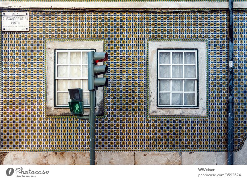 Green traffic light in front of facade in Lisbon ampelmännchen Portugal Facade tiles variegated House (Residential Structure) Traffic light Window Tile