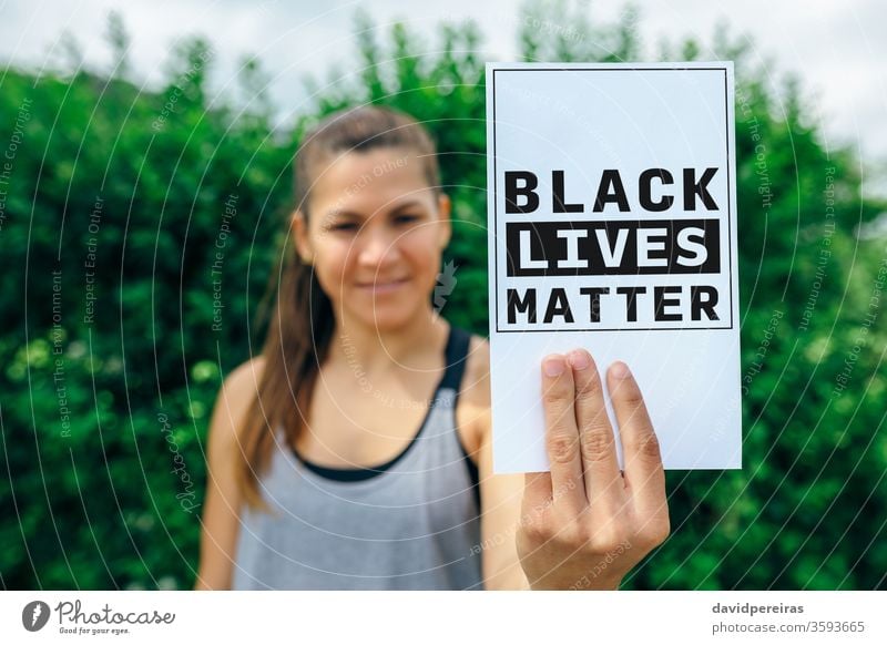 Woman showing symbol against racism black lives fist matter xenophobia abuse discrimination protest sign card equality defense pacific pacifist indignation
